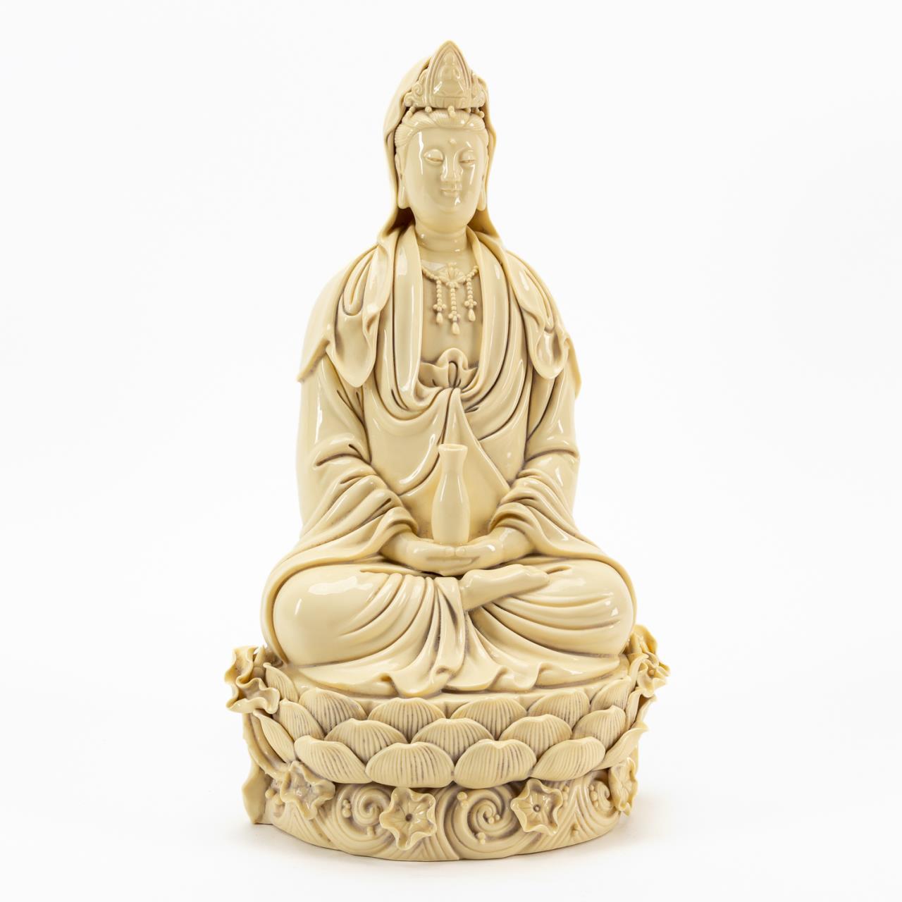 Appraisal: CHINESE BEIGE GLAZED DEHUA SEATED GUANYIN Chinese beige glazed Dehua