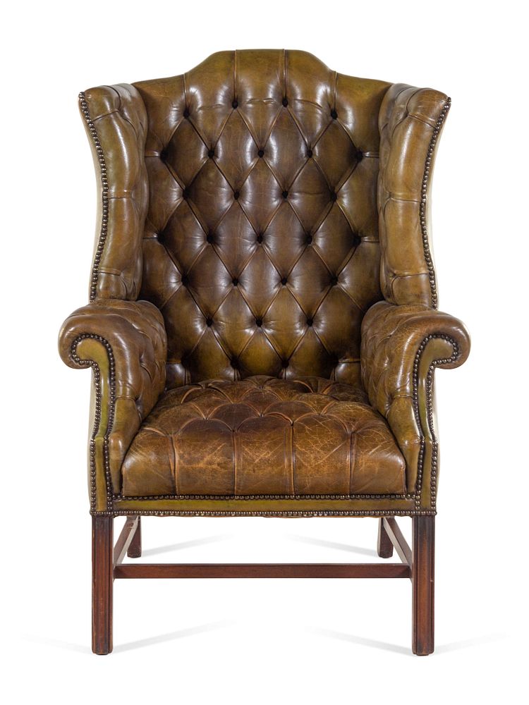 Appraisal: An English Leather Upholstered Mahogany Wingback Armchair An English Leather