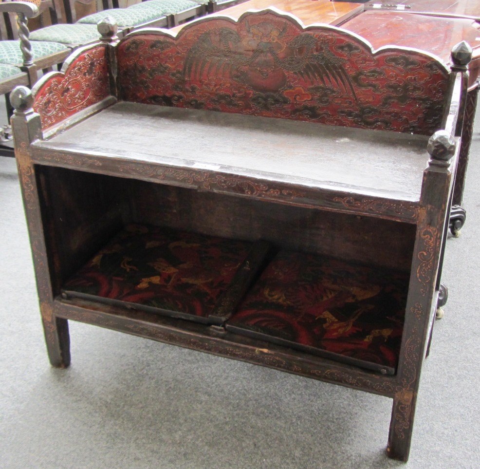 Appraisal: A th century Eastern red lacquer polychrome painted side cabinet