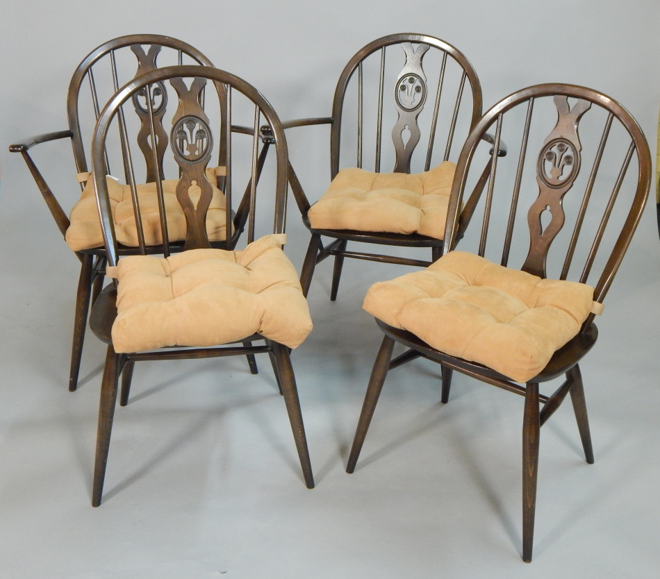 Appraisal: A set of four Ercol dark stained dining chairs each