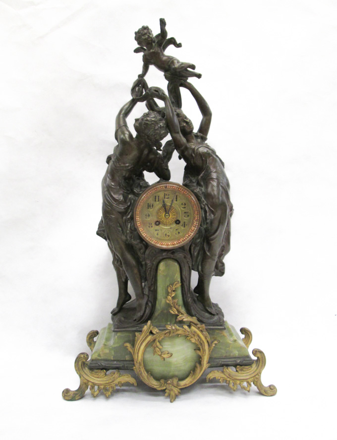 Appraisal: SPELTER AND ORMOLU-MOUNTED GREEN ONYX DOUBLE STATUE CLOCK Louis Boname