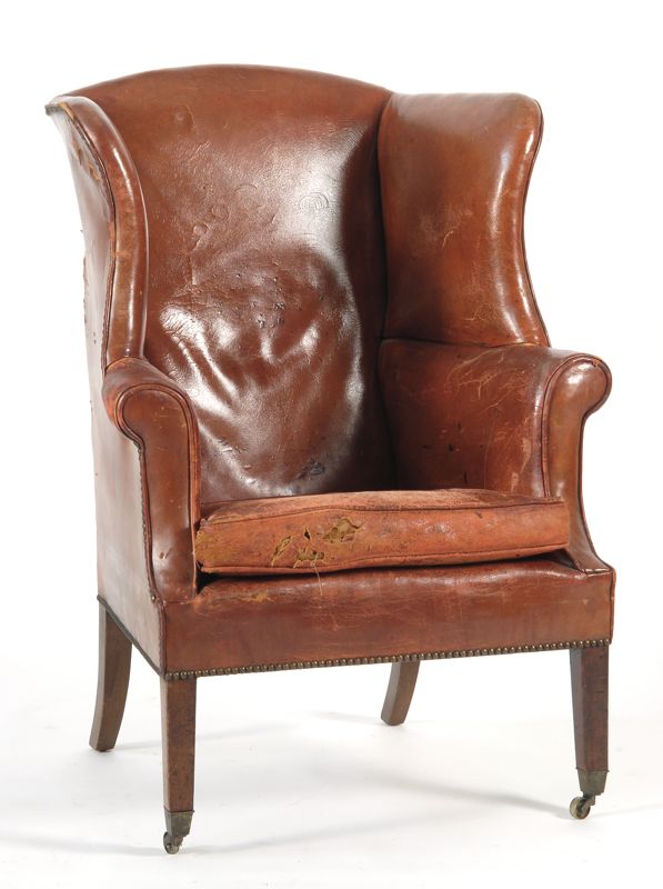 Appraisal: ANTIQUE HEPPLEWHITE WING CHAIR In mahogany with old red leather