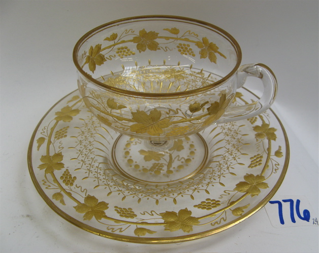 Appraisal: ITALIAN CUT CRYSTAL AND GOLD DECORATED CUPS AND SAUCERS set