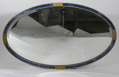 Appraisal: A gilt wood and blue stained veneer wall mirror elliptical