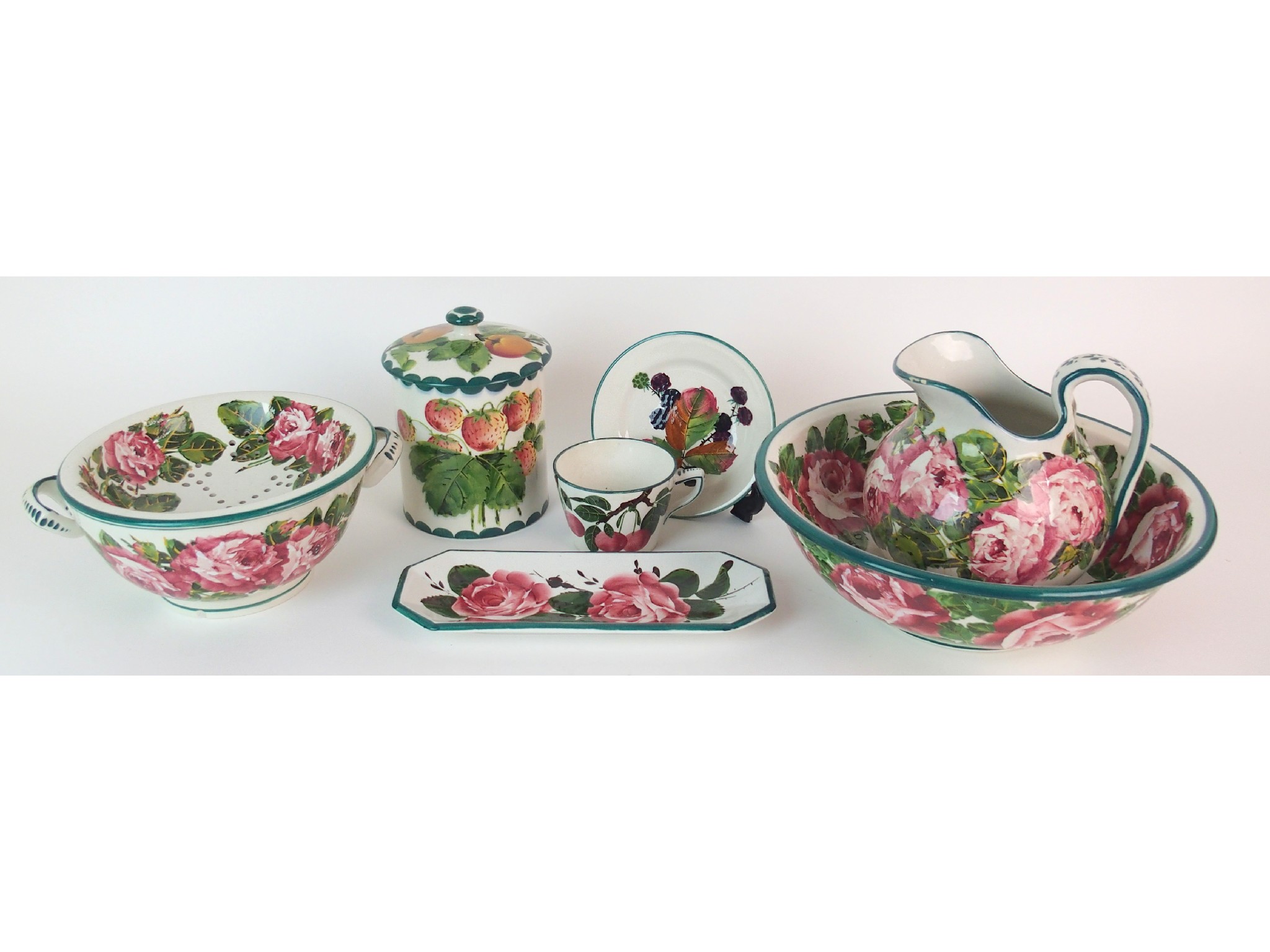 Appraisal: A Wemyss Ware preserve jarwith strawberries and apples cover impressed