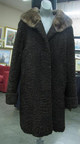 Appraisal: A vintage chocolate Persian lamb coat with mink collar shoulder