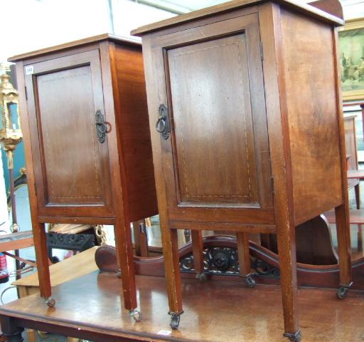 Appraisal: A pair of Edwardian mahogany bedside pot cupboards with opposing