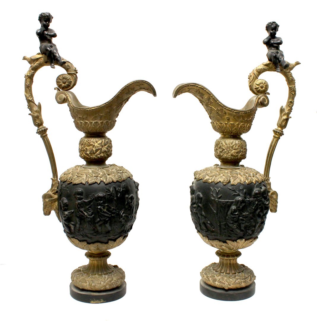 Appraisal: A pair of painted bronze ewers late th early th