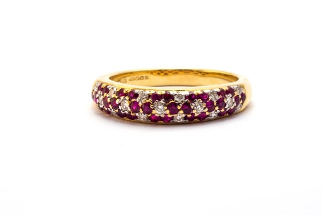 Appraisal: An ct gold diamond and ruby set half hoop ring