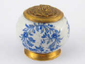 Appraisal: A ceramic inkwell the white ground with blue overglaze floral