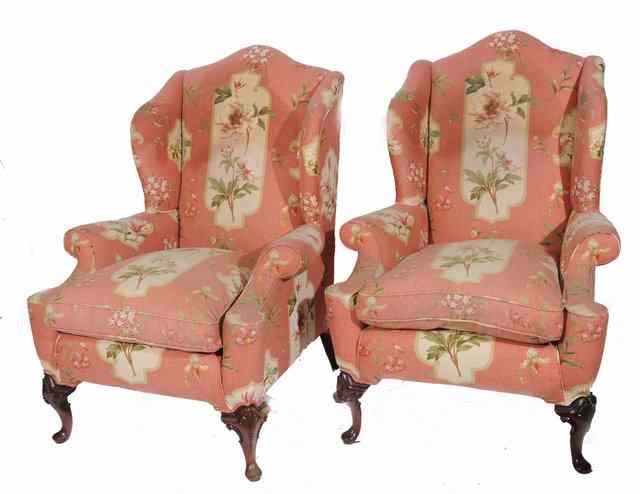 Appraisal: A PAIR OF GEORGIAN STYLE WING BACK ARMCHAIRS with pink