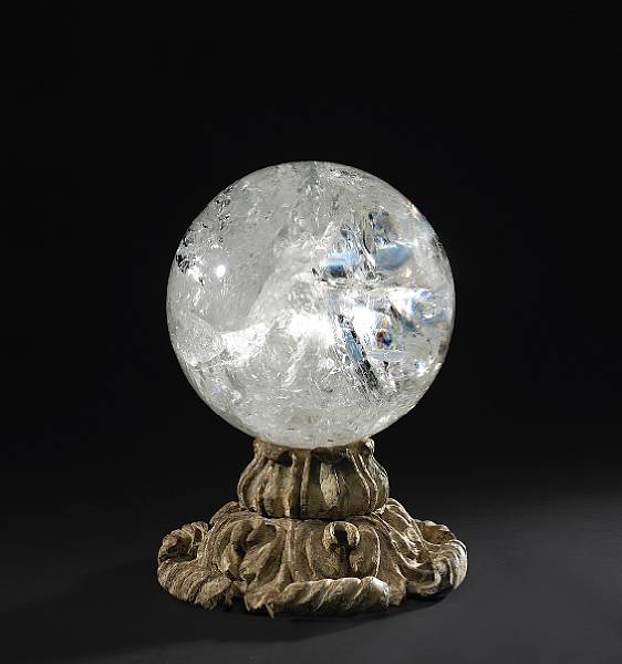 Appraisal: A rock crystal orb on th century giltwood base The