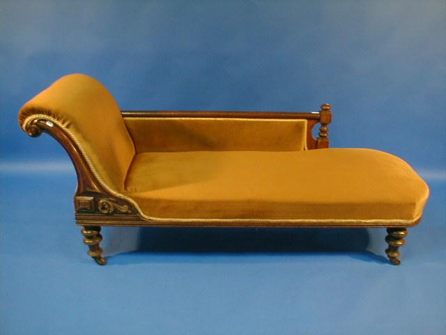 Appraisal: A Victorian oak framed chaise lounge upholstered in gold draylon