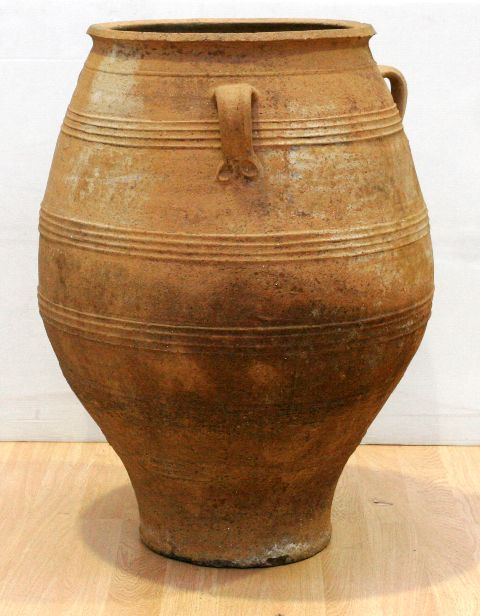 Appraisal: A large terracotta urn with three handles cms x cms