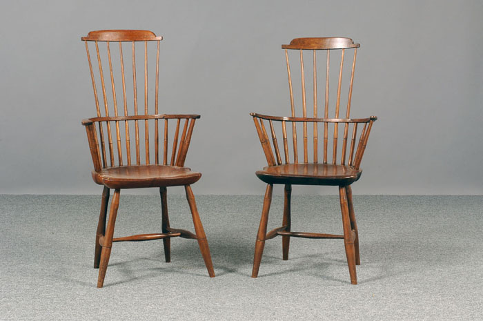 Appraisal: TWO SIMILAR COMB-BACK WINDSOR ARMCHAIRS The stepped comb crest above