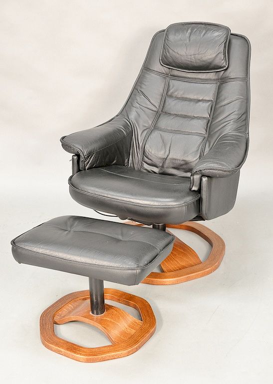 Appraisal: Leather easy chair and ottoman Leather easy chair and ottoman