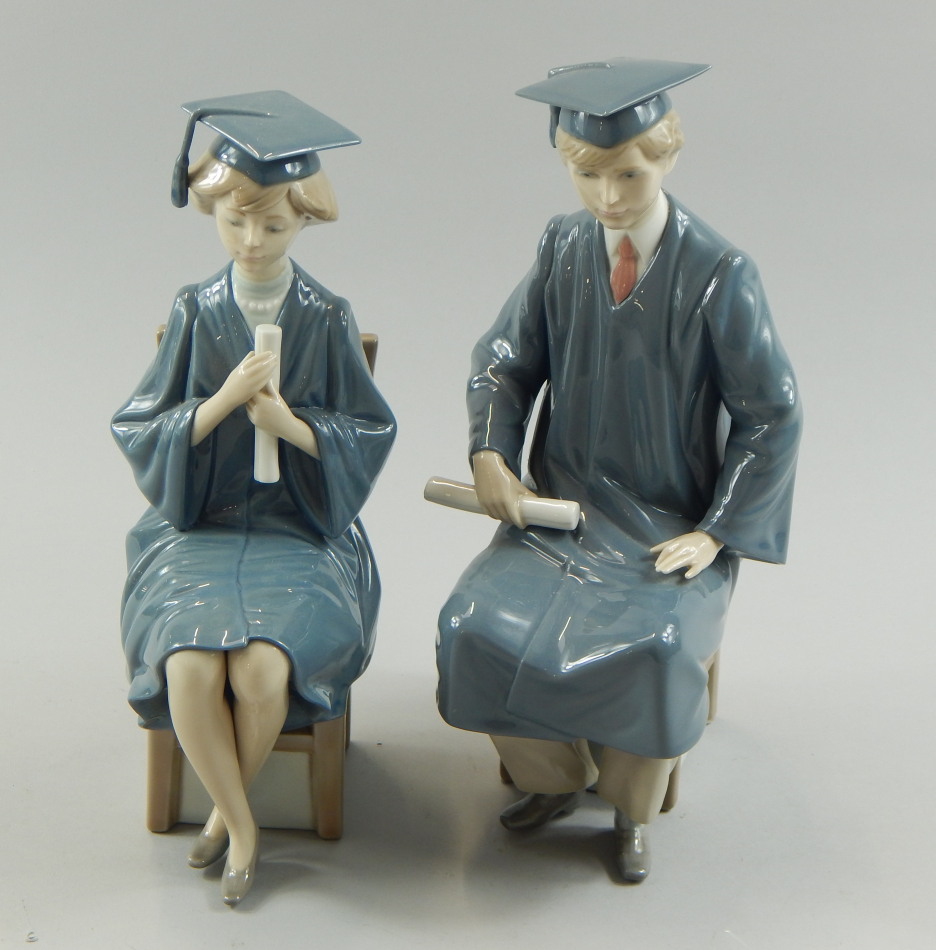 Appraisal: A pair of Lladro porcelain figures each modelled as students