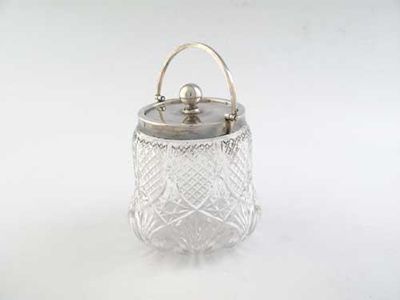 Appraisal: An Edwardian mounted cut glass biscuit barrel bell shaped with