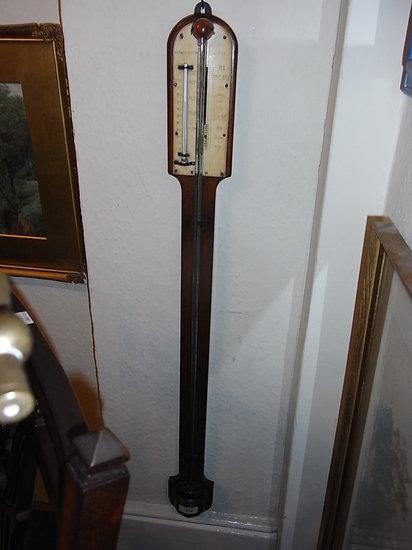 Appraisal: A LATE VICTORIAN OAK STICK BAROMETER with themometer the arched