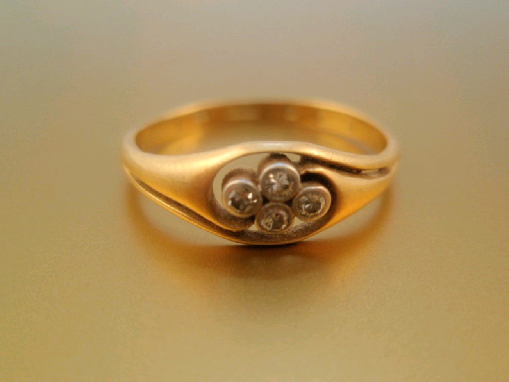 Appraisal: An ct gold dress ring set with four small diamonds