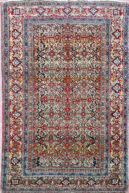 Appraisal: A Kashan rug early th century the claret field with