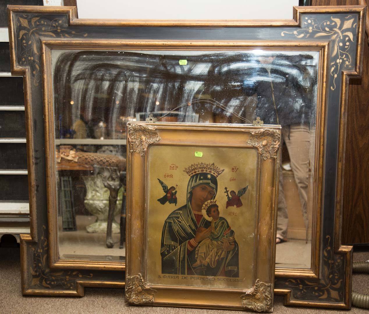 Appraisal: Painted wall mirror and a framed Madonna print