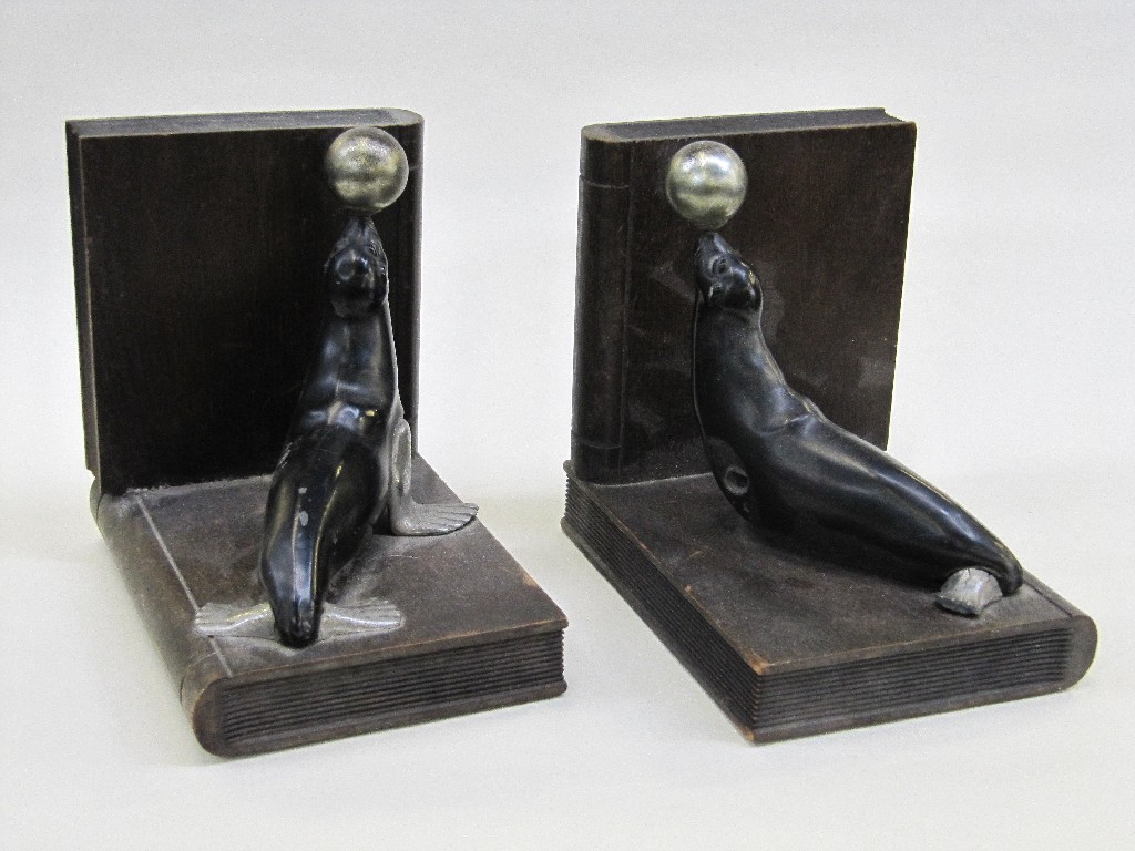 Appraisal: Pair of Art Deco bookends modelled with sealions with balls