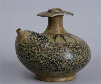 Appraisal: THAI SAWANKALOKE BROWN AND CREAM-GLAZED POTTERY KENDI The flattened gobular