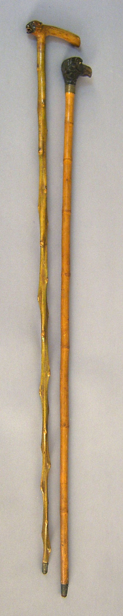 Appraisal: Two canes with dog head and eagle grips