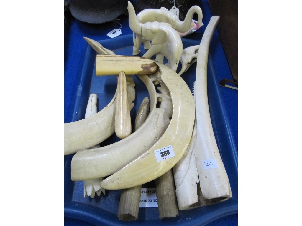 Appraisal: Tray lot of tusks and a pair of carved elephant