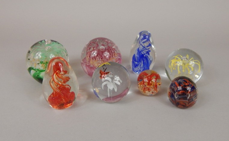 Appraisal: Various coloured glass paperweights to include one decorated with flowers