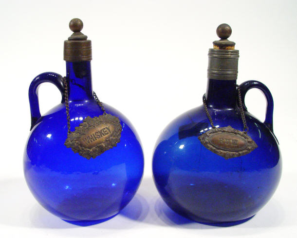 Appraisal: Two Bristol blue glass decanters with pewter mounts and stoppers