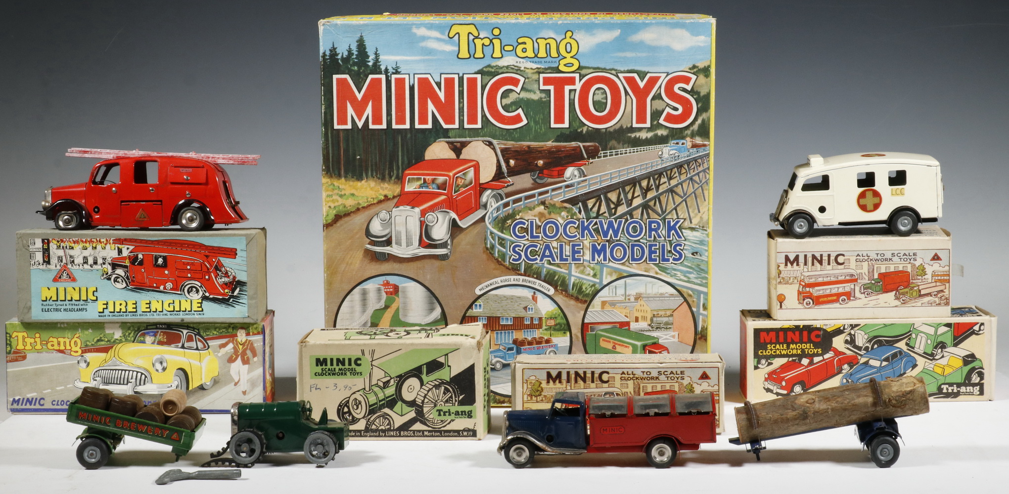 Appraisal: ASSORTED TRI-ANG MINIC CLOCKWORK VEHICLES Collection of British Made Tri-ang