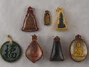 Appraisal: Seven various Buddhist and other talisman pendants one with gold