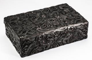 Appraisal: Chinese relief carved and ebonized dragon box l Chinese carved