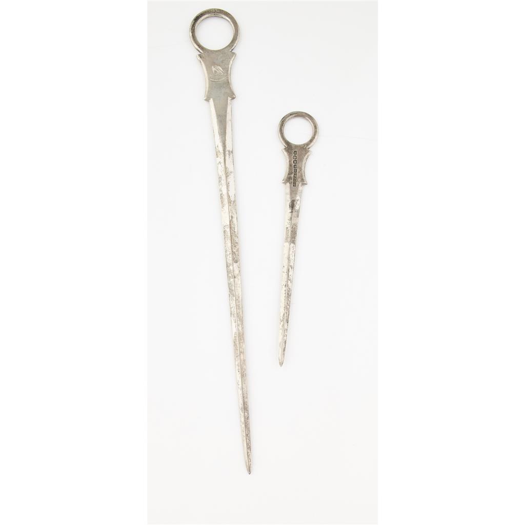 Appraisal: A graduated pair of Colonial meat skewers marked J G