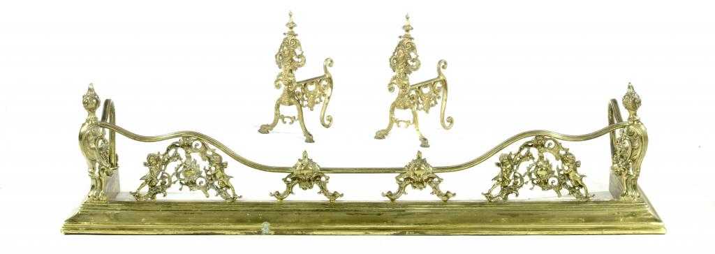 Appraisal: AN EDWARD VII BRASS ROCOCO REVIVAL FENDER with scrolling rail