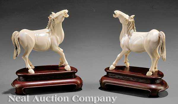 Appraisal: A Pair of Chinese Ivory Figures of Horses each animated