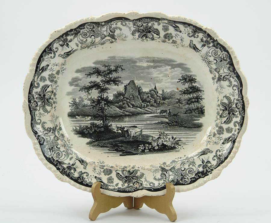 Appraisal: TWO DECORATED STAFFORDSHIRE PLATTERS Black transfer Park Scenery London China