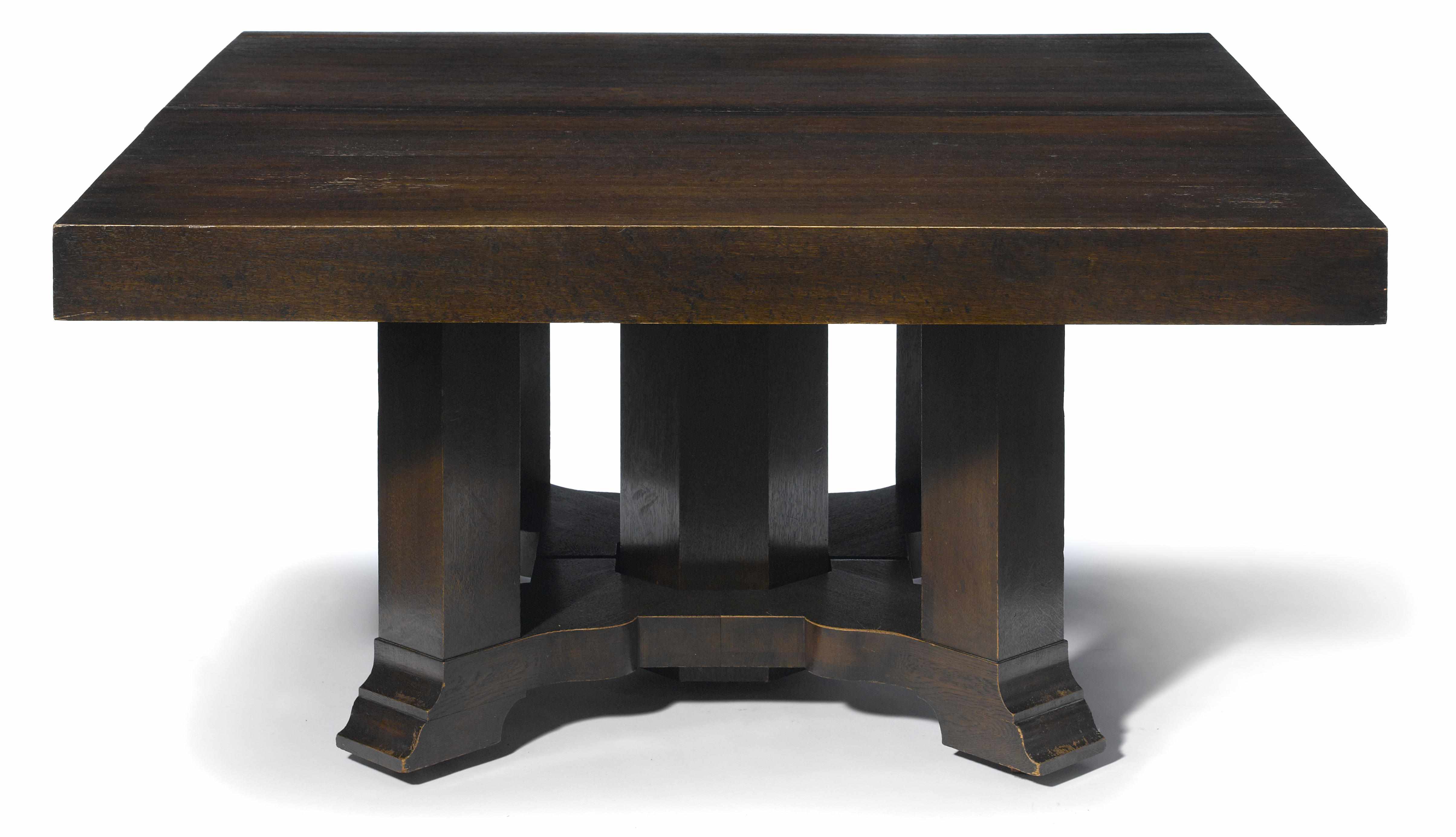 Appraisal: An Arts Crafts oak extension dining table includes leavesheight in