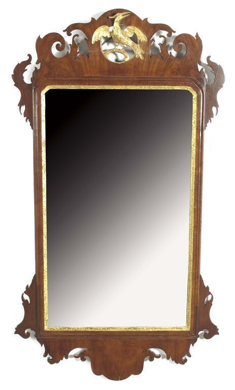 Appraisal: A mahogany and parcel gilt fret-frame mirror in mid th