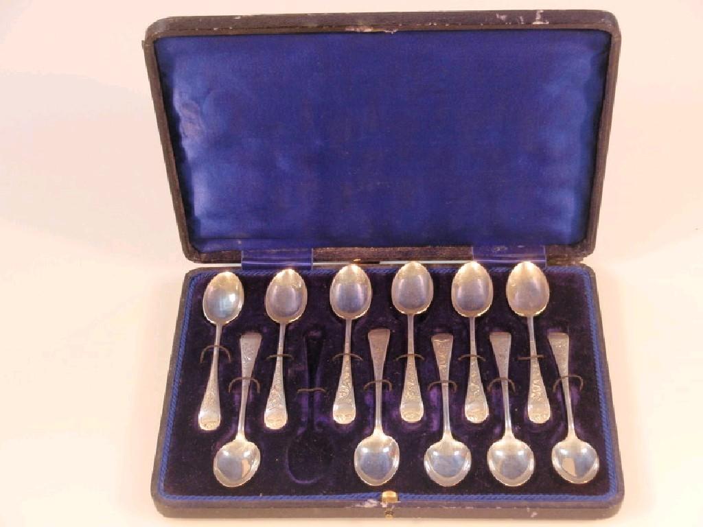 Appraisal: Eleven silver teaspoons with engraved scroll decoration Birmingham with fitted