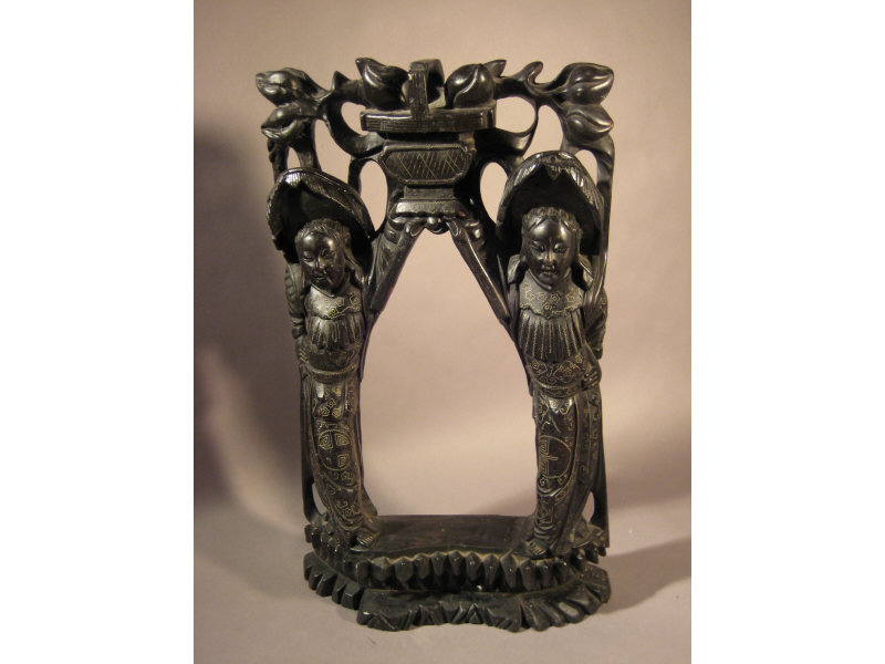 Appraisal: CHINESE CARVED BELL STAND WITH SILVER INLAY Showing two figures