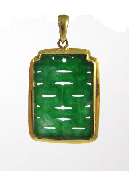 Appraisal: GREEN JADE AND FOURTEEN KARAT GOLD PENDANT Framed in yellow