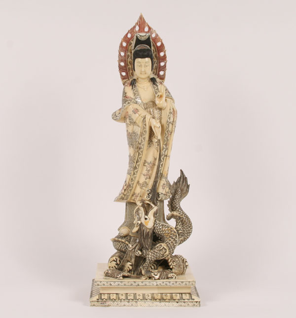 Appraisal: Chinese goddess figure with mythical beast on decorated base Serpent