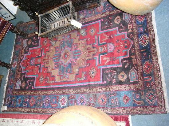 Appraisal: A HAMADAN RED GROUND RUG with central medallion within a