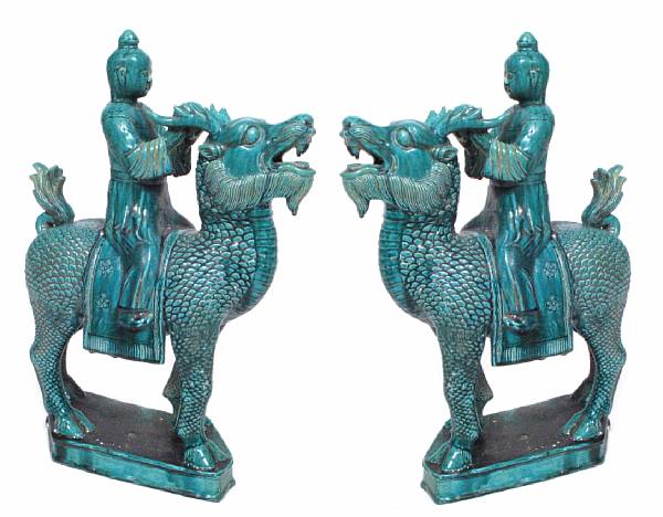 Appraisal: A pair of Chinese green glazed figures on dragon horses