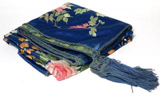 Appraisal: Embroidered silk piano shawl having a polychrome floral medallion with