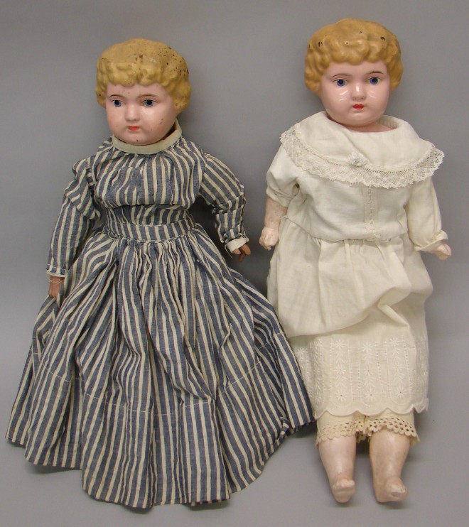 Appraisal: Pair of metal head dolls marked GERMANY Both have painted