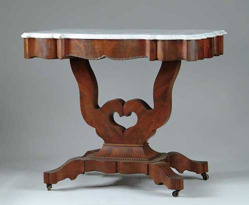 Appraisal: EMPIRE MARBLE TOP MAHOGANY TABLE Shaped white marble conforms to